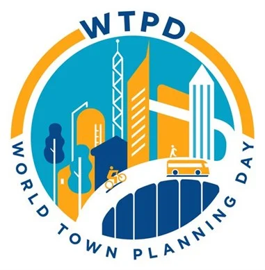 World Town Planning day logo showing cartoon buildings in orange and blue