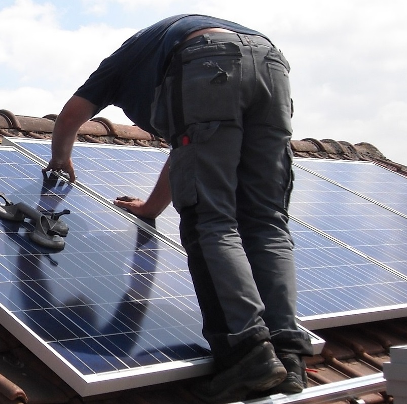 Man fitting solar panels