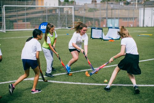 Girls playing hockey