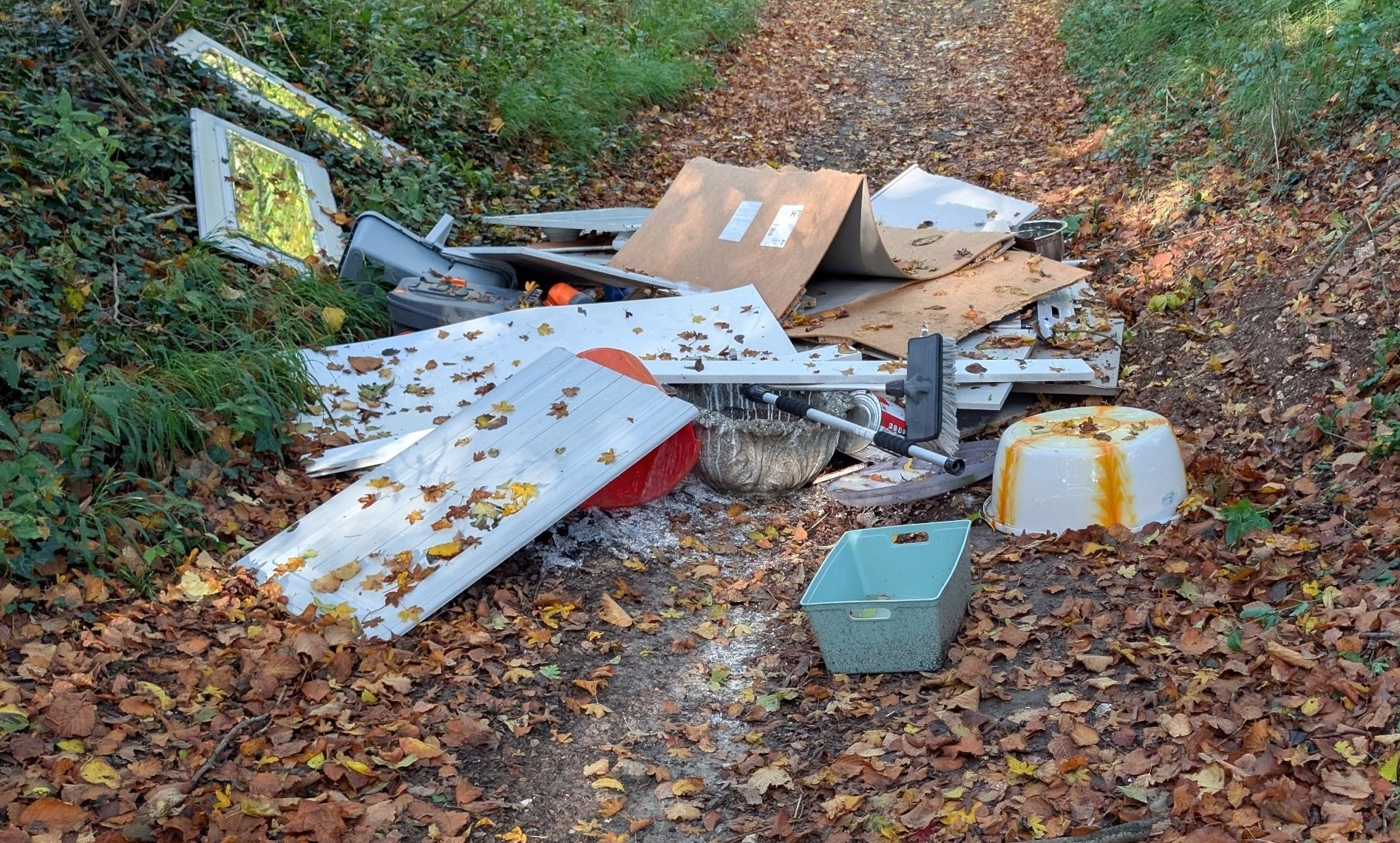 Pile of household waste in a country lane