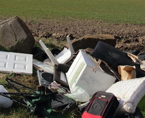Household rubbish dumped in field