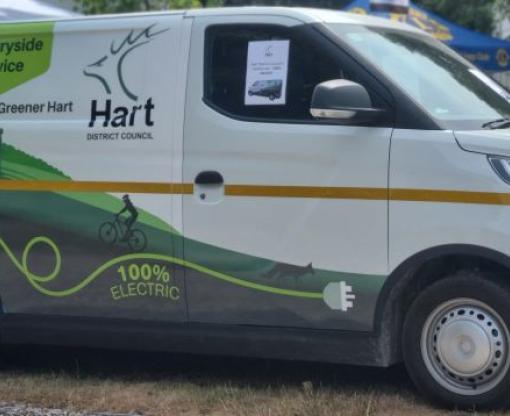 Countryside Service white electric van with Hart District logo and image of countryside on side of van