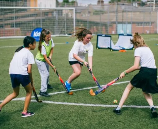 Girls playing hockey