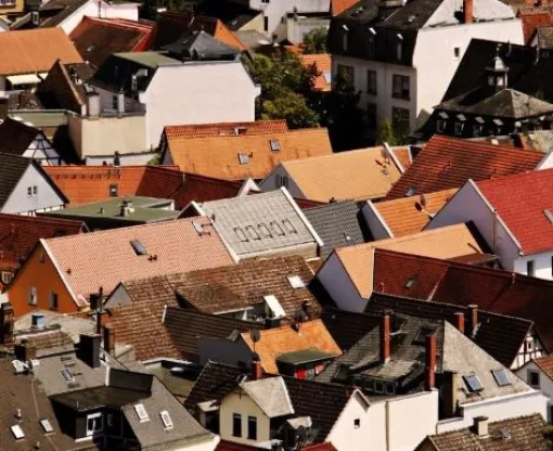 An aerial view of the roofs of houses