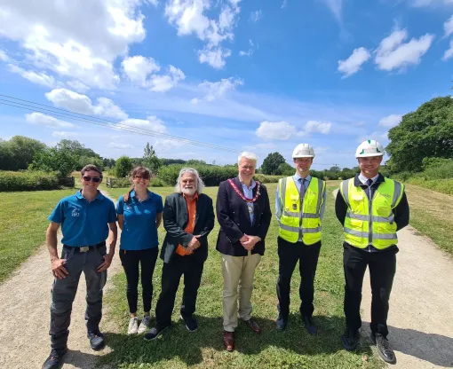 An image showing Hart staff, Councillors and Berkley homes staff opening a new extension to Edenbrook Country Park
