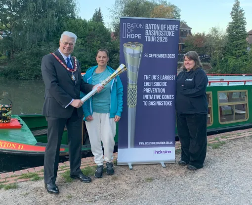 Chairman Councillor Chris Dorn with the Baton of Hope