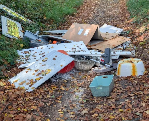 Pile of household waste in a country lane