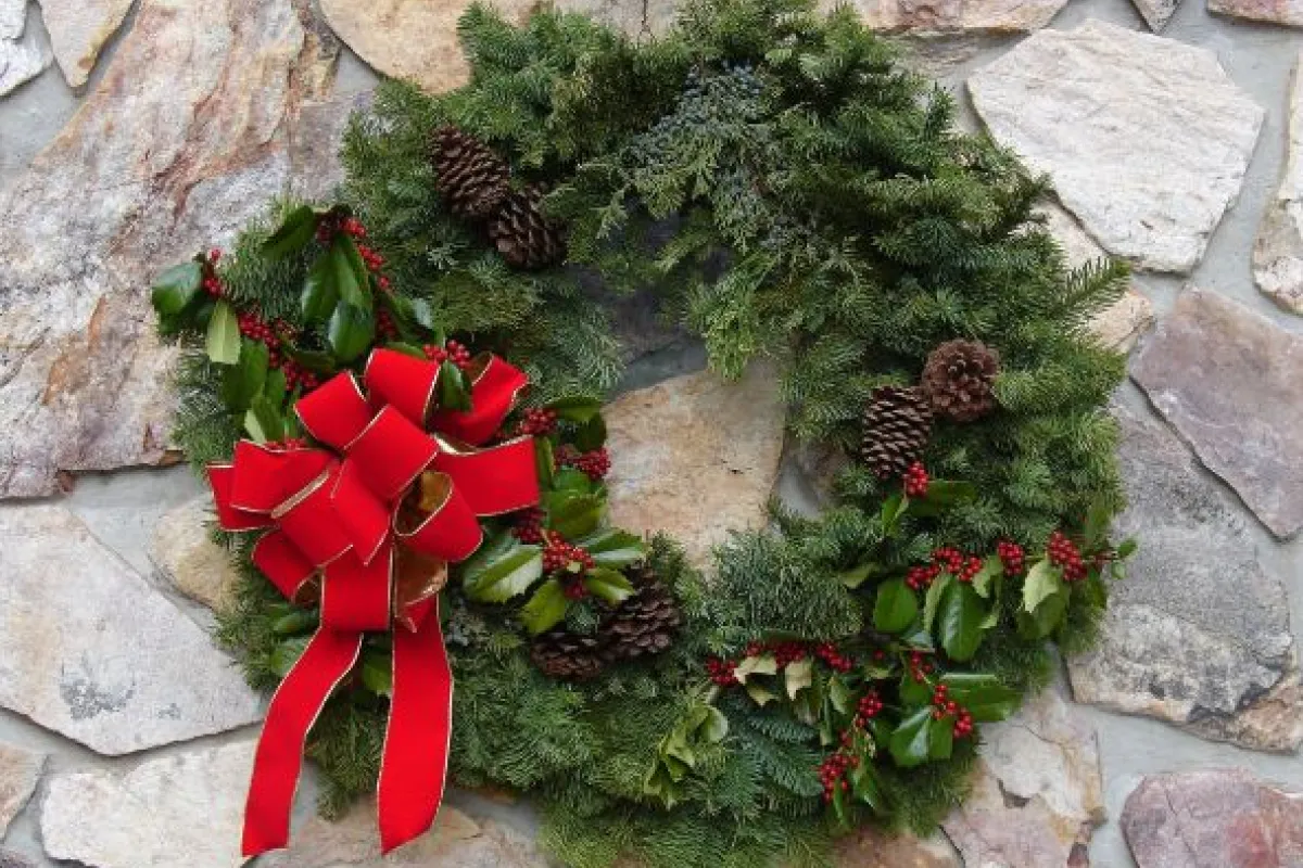 Green Christmas wreath with red bow