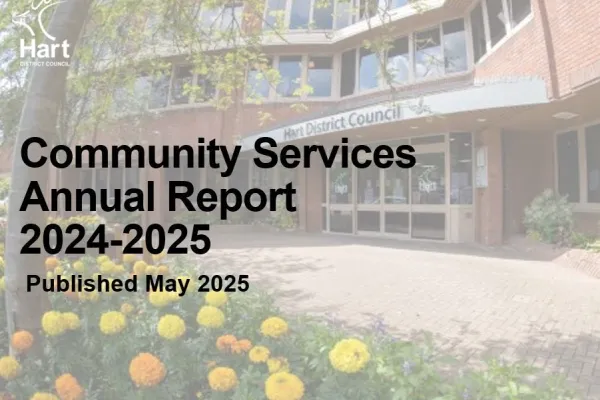 Red brick building office building with yellow and orange flowers in foreground with title Community Services Annual Report 2024-2025