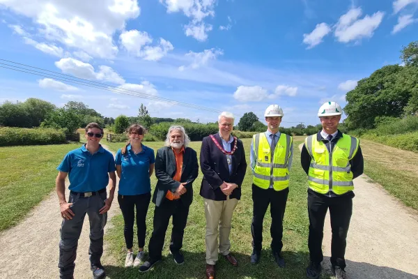 An image showing Hart staff, Councillors and Berkley homes staff opening a new extension to Edenbrook Country Park