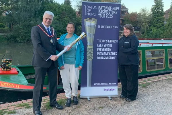 Chairman Councillor Chris Dorn with the Baton of Hope