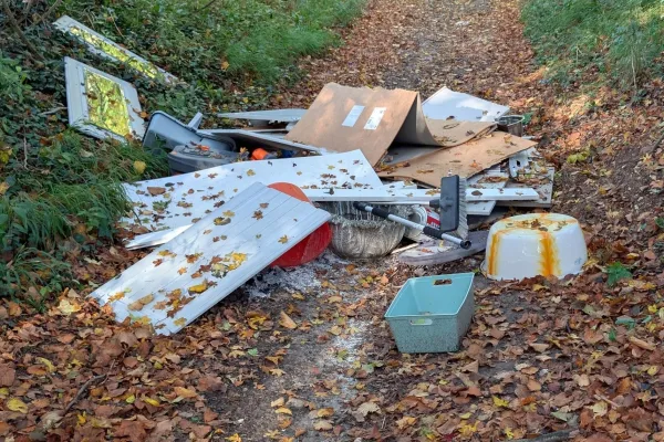 Pile of household waste in a country lane