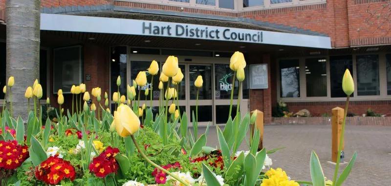 Yellow and red flowers in front of Hart District Council building