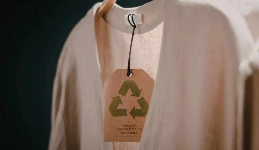 Photo of cardigan for sale with a recycled label on it