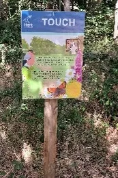 A wooden sign explaining what to do at point four. The text is mirrored on the webpage